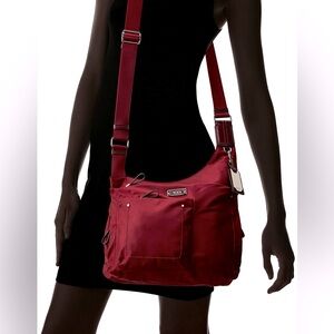 TUMI Voyager Sumatra Crossbody. Gently used .